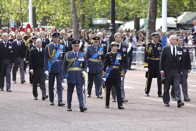 Queen Elizabeth II's coffin is taken in procession on a Gun Carriage of The King's Troop Royal Horse Artillery from Buckingham Palace to Westminster Hall where she will lay in state until the early morning of her funeral. Queen Elizabeth II died at Balmoral Castle in Scotland on September 8, 2022, and is succeeded by her eldest son, King Charles III.