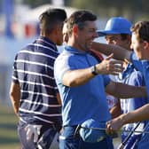 Rory McIlroy and Matt Fitzpatrick celebrate on the 15th green during yesterday's memorable Ryder Cup start by Team Europe. (Photo by Mike Ehrmann/Getty Images)