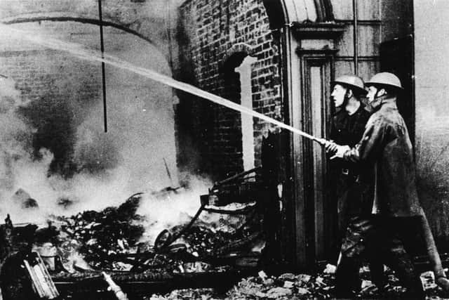 Firemen tackling the devastation caused during the Belfast Blitz of 1941.