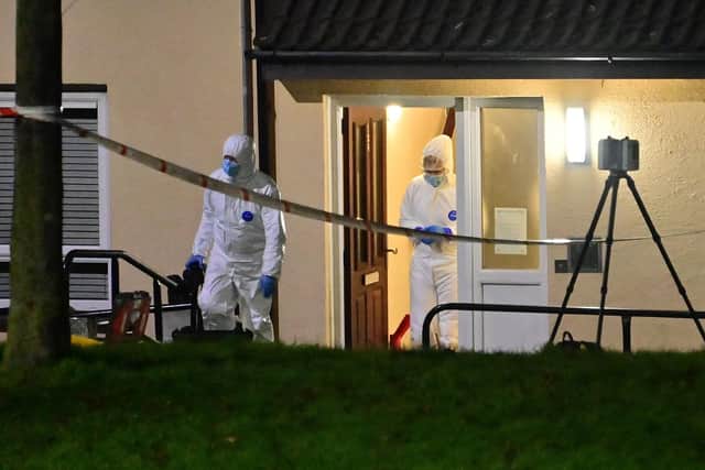 Forensic officers at the scene of the murder investigation in Lurgan.
Pic Colm Lenaghan/Pacemaker
