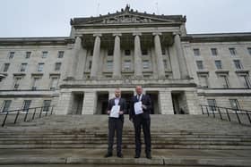 Loyalist activist Jamie Bryson (left) and TUV leader Jim Allister at Stormont holding legal advice that says there is still an Irish Sea border as the assembly returns. But London has moved away from a neutral approach to Northern Ireland, accelerated by ​Ireland’s hypocritical legacy legal action against the UK. Photo: Brian Lawless/PA Wire