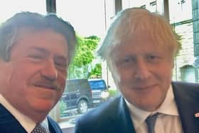 Roger Lomas, pictured here with Boris Johnson, is a founding member of the NI Conservatives Party. He is calling for Chris Heaton Harris to attend the NI Conservative Party's AGM in June - which he says is normal for a Tory Secretary of State.