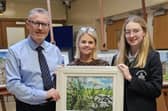 Principal Ian McConaghy with Edele McMahon Head of Art, and student artist Ellie, from Year 11, together with some of the art going on display.