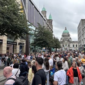 Members of the public watch performers at Fleadh Cheoil na hÉireann 2026, in Belfast.