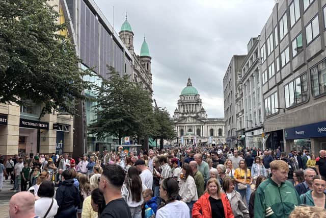 Members of the public watch performers at Fleadh Cheoil na hÉireann 2026, in Belfast.