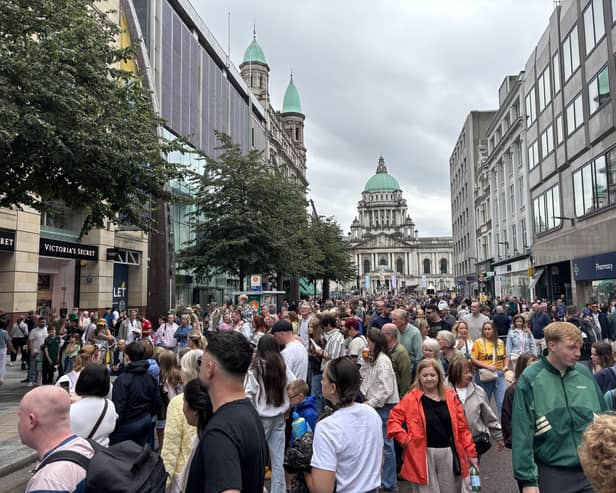 Members of the public watch performers at Fleadh Cheoil na hÉireann 2026, in Belfast.