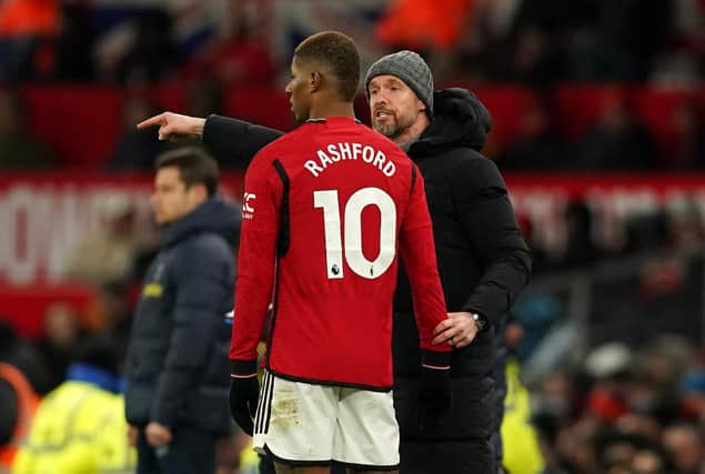 Manchester United's Marcus Rashford with manager Erik ten Hag. (Photo by Martin Rickett/PA Wire)