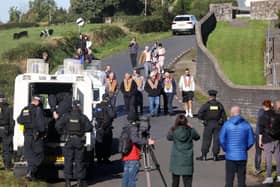 ​Orangemen await instruction to continue their parade down the Garvaghy Road