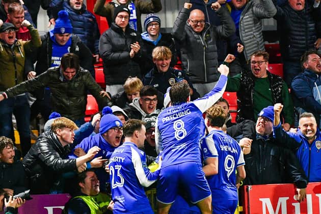 Coleraine celebrate in front of the away fans after Joel Cooper's match-winning strike on Friday during a stunning 3-2 comeback win from 2-0 down at defending champions Larne. (Photo by Andrew McCarroll/Pacemaker Press)