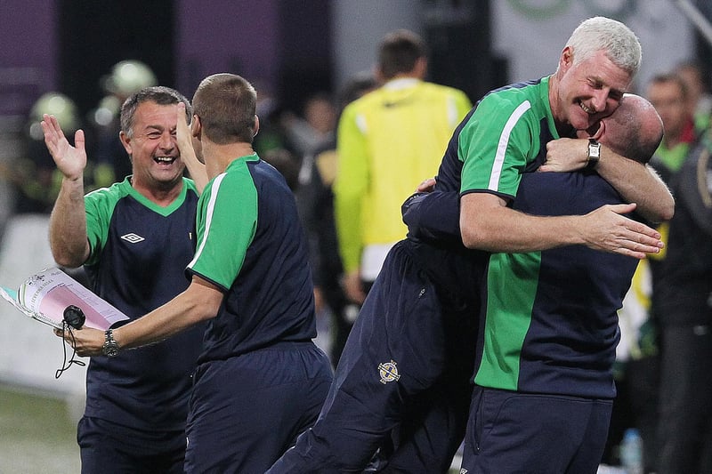 Northern Ireland manager Nigel Worthington and his staff celebrate after Corry Evans put them 1-0 up in Maribor