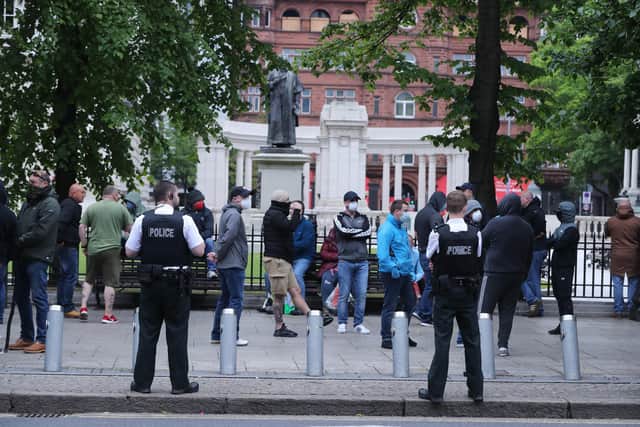 People gather outside City Hall in Belfast in June 2020 to protect war memorials in its grounds