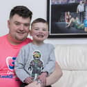 Daithi MacGabhann with his dad Mairtin MacGabhann at their home in Belfast. Daithi has been on the heart transplant waiting list since 2018