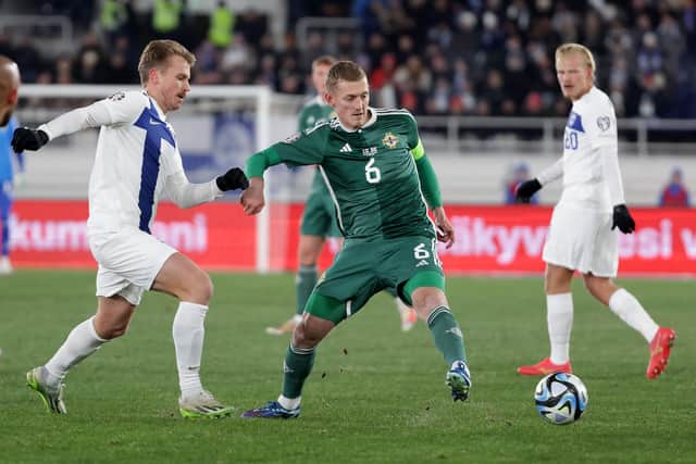 Northern Ireland’s George Saville with Finland’s Rasmus Schüller during Friday night’s UEFA Euro 2024 qualifier at the Olympic Stadium in Helsinki, Finland. PIC: William Cherry/Presseye