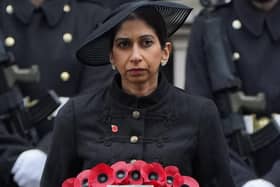 Suella Braverman holds a wreath during the Remembrance Sunday service at the Cenotaph, in Whitehall, London. She was sacked as home secretary earlier this week by prime minister Rishi Sunak following days of speculation over her future after she penned an article in the Times accusing the police of bias