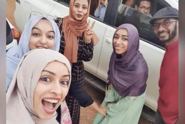 Dr Sarah Ahmed (front left in beige scarf) seen here in happier times with her sisters and and-in-laws in Sudan.