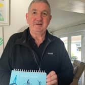 Peter Jackson at home in Saintfield with his Lifestyle log book. Photo: South Eastern Health and Social Care Trust