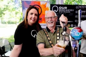 The Mayor of Antrim and Newtownabbey, Councillor Henry Cushinan perfecting his pour at Antrim Castle Garden's Beer Festival in June. Photo provided by Antrim and Newtownabbey Borough Council