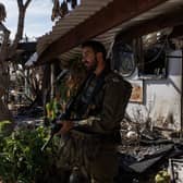 Israeli soldiers yesterday patrolling Kibbutz Nir Oz, southern Israel, which was overran by Hamas terrorists on October 7, killing or capturing a quarter of its community. The terrorist attack will be remembered as Israel's 9/11, writes Nigel Mooney