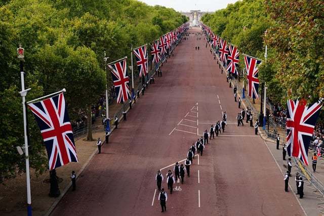 Police officers take up position along The Mall ahead of the ceremonial procession of the coffin of Queen Elizabeth II from Buckingham Palace to Westminster Hall, London.