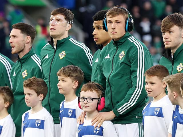 Northern Ireland player Daniel Ballard and eight-year-old mascot Charlie Kerrigan wearing ear defenders before Sunday's EURO 2024 qualifier against Finland