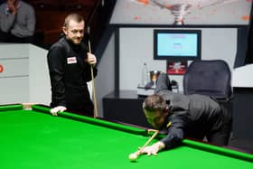 Mark Selby (right) plays a shot as Mark Allen watches on during their semi-final clash at the World Snooker Championship at the Crucible on Friday.
