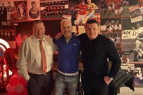Ally Kerr (centre) with Larne chairman Gareth Clements (left) and owner Kenny Bruce (right)