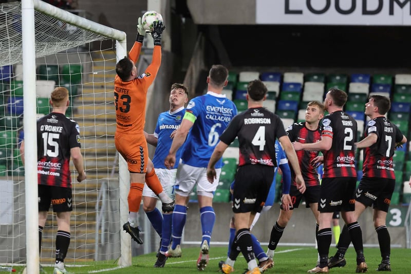 Crusaders goalkeeper Jonny Tuffey rises highest to claim the ball against Linfield