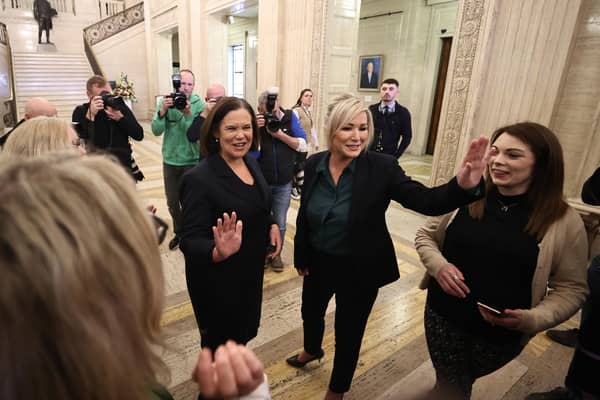 Sinn Fein president Mary Lou McDonald (centre) and vice-president Michelle O'Neill, wave after speaking to students from Mount Lourdes Grammar in Enniskillen, after addressing media today in the Great Hall at Stormont, Belfast
