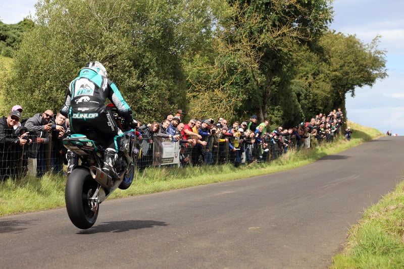 Michael Dunlop leaps his way to victory on he Hawk Racing Honda during the Open race at the Armoy Road Races