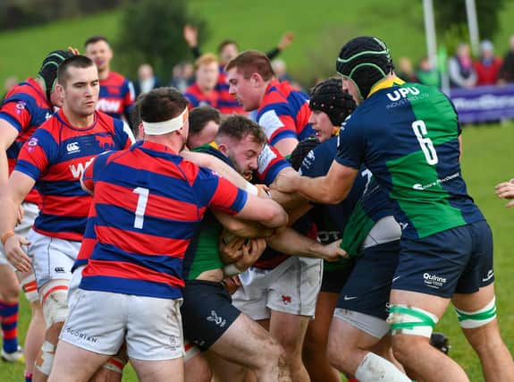 Ballynahinch's Matty Rea swamped by Clontarf players in the weekend All-Ireland League meeting at Ballymacarn Park. (Photo by Andrew McCarroll/Pacemaker Press)