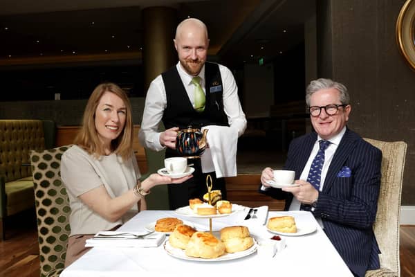 A Tourism NI campaign aimed at encouraging more people to consider a career in the tourism and hospitality industry attracted more than 30,000 visits to its website in less than one month. Pictured are Eimear Callaghan, head of experience & industry development at Tourism NI with James McGinn, MD of Hastings Hotels and waiter, Aaron Hughes