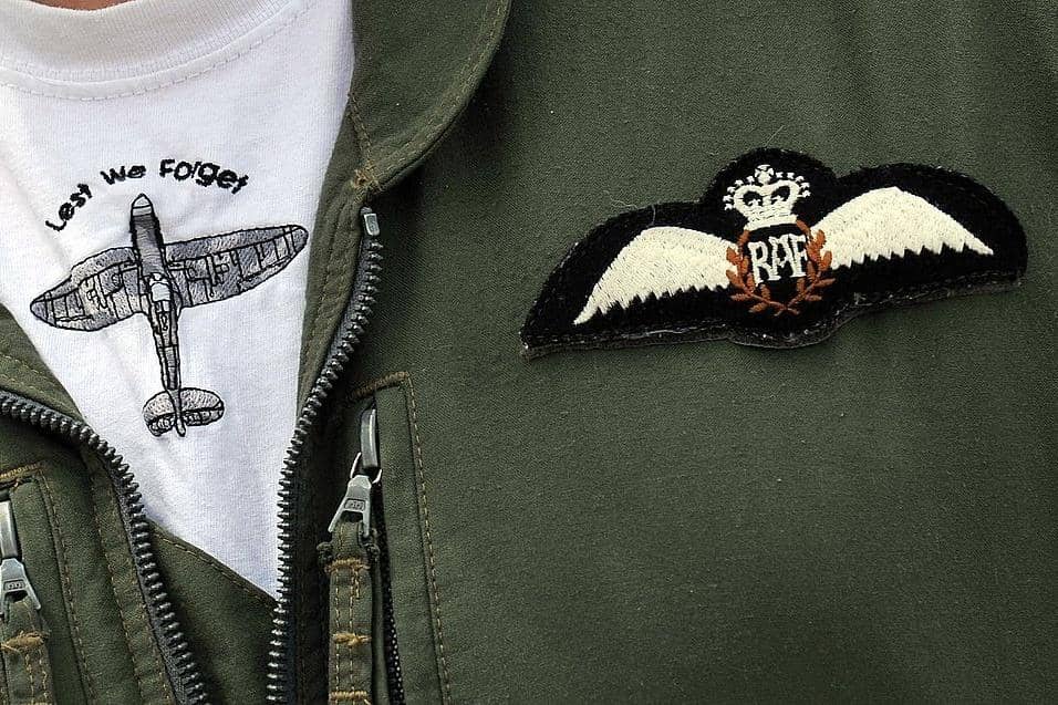 A Spitfire aircraft logo is displayed on the flight suit of an airman from the RAF during a display at RAF Coningsby in Lincolnshire, central England (photo credit should read PAUL ELLIS/AFP via Getty Images)