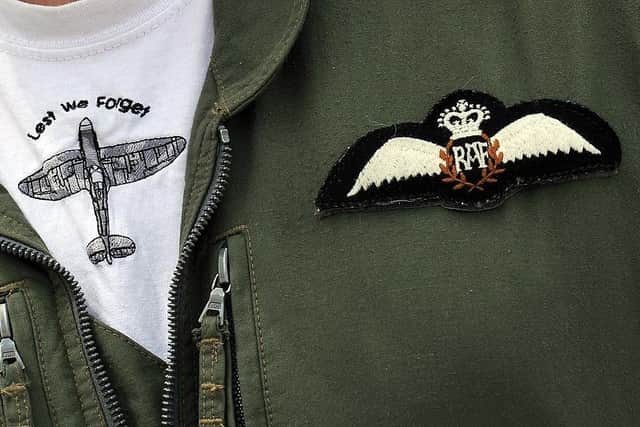 A Spitfire aircraft logo is displayed on the flight suit of an airman from the RAF during a display at RAF Coningsby in Lincolnshire, central England (photo credit should read PAUL ELLIS/AFP via Getty Images)