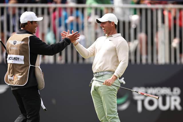Rory McIlroy enjoys the moment with caddie Harry Diamond after putting in to win the Genesis Scottish Open. (Photo by Jared C.Tilton/Getty Images)