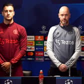 Manchester United's Diogo Dalot and manager Erik ten Hag observe a minute's silence for Sir Bobby Charlton ahead of a Champions League press conference at the Trafford Training Centre in Carrington. (Photo by Nick Potts/PA Wire).