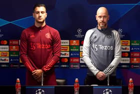 Manchester United's Diogo Dalot and manager Erik ten Hag observe a minute's silence for Sir Bobby Charlton ahead of a Champions League press conference at the Trafford Training Centre in Carrington. (Photo by Nick Potts/PA Wire).