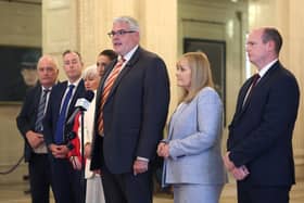 (Left to right) Trevor Clarke MLA, Education Minister Paul Givan MLA, Junior Minister Joanne Bunting MLA, deputy First Minister Emma Little-Pengelly, DUP party leader Gavin Robinson MP, deputy party leader Michelle McIlveen MLA, and Communities Minister Gordon Lyons speaking to members of the media, in the Great Hall in Stormont, Belfast. today