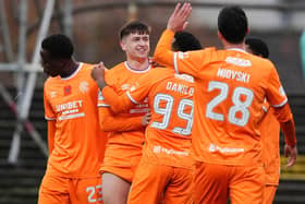 Mikey Moore (second left) who believes he has emerged from the toughest time of his fledging career to at last find top form for Rangers