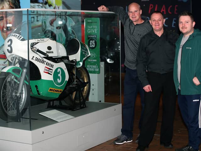 Ryan Farquhar, Phillip McCallen and Gary Dunlop pictured at the new display of racing motorcycles at the Ulster Transport Museum