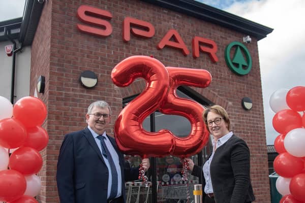 Well-known local retailers, Charlie and Ruth Hamilton are celebrating 25 years serving the local community from their Tamlaght Road Spar. Pictured are Charlie and Ruth Hamilton celebrate their 25 year milestone (Jason McCartan Photography)