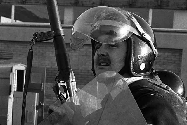 RUC officer with a baton gun during an H Block demonstration in 1980