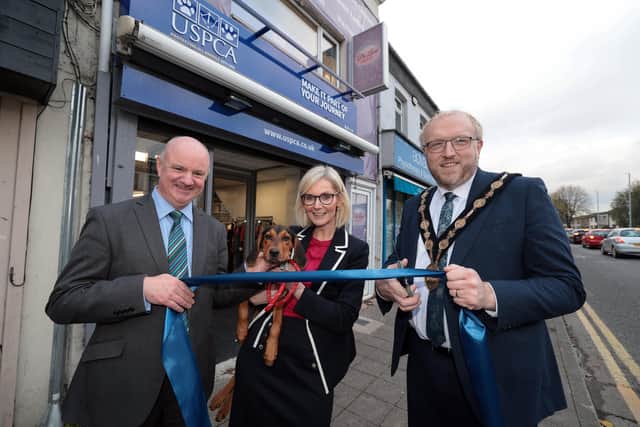 Animal welfare charity opens new store in the heart of Lisburn. Pictured are chair of the USPCA, Dr John Farrell, Skye the dog, chief executive of the USPCA, Nora Smith, Lisburn and Castlereagh City Council mayor, Andrew Gowan. Pic credit: Matt Mackey