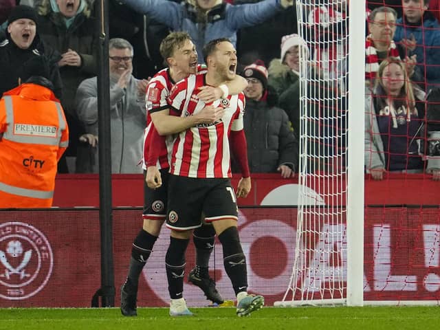 Sheffield's Billy Sharp, centre, celebrates after scoring his side's second goal during Tuesday night's FA Cup 4th round replay against Wrexham