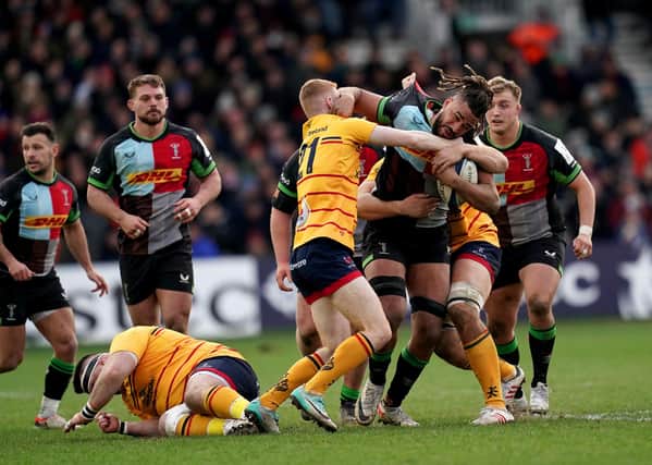 Harlequins' Chandler Cunningham-South is tackled by Ulster's Nathan Doak in the weekend Champions Cup match at Twickenham Stoop, London. (Photo by Adam Davy/PA Wire)