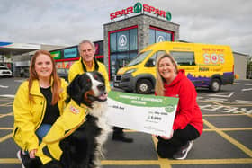 Caitlin McCartney, Ken Humphrey and Harvey the dog from SOS Bus NI are pictured with Bronagh Luke from Spar NI at Henderson Group receiving their Community Cashback Grant last year. Applications for the 2024 Grant are open until May 22, and this year will see 20 organisations receive £1,000 each