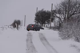 Library image of a car struggling in snowy conditions