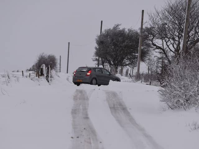 Library image of a car struggling in snowy conditions