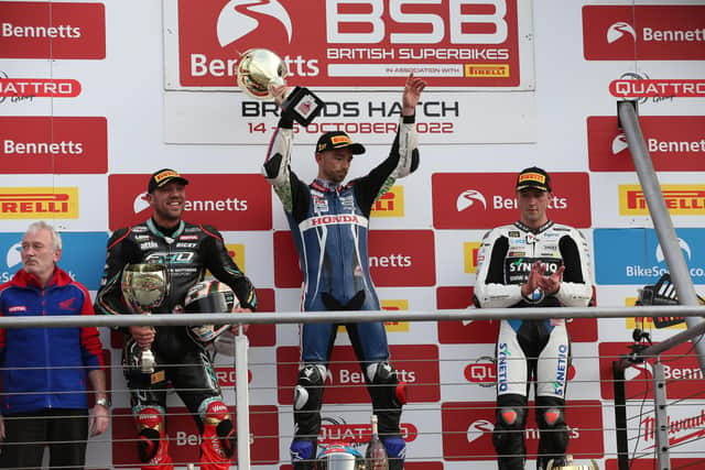 Glenn Irwin celebrates victory in Saturday's British Superbike Sprint race at Brands Hatch from runner-up Peter Hickman (left) and Andrew Irwin.