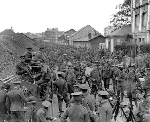 British Expeditionary Force soldiers en route to Mons in Belgium on August 17 1914, a fortnight after Britain entered the Great War. Days later Arthur Moore came across soldiers ordered to retreat from Amiens, well south of Mons, during a rapid German advance