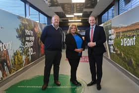 Economy Minister Gordon Lyons is pictured with Belfast International Airport managing director Graham Keddie and Ainsley McWilliams, Tourism NI at the recently revamped domestic arrivals corridor at Belfast International Airport